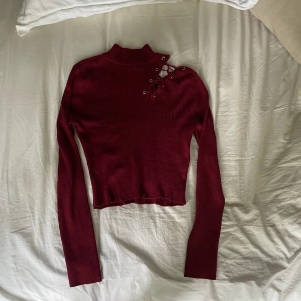 Red top with cut out shoulder/seam